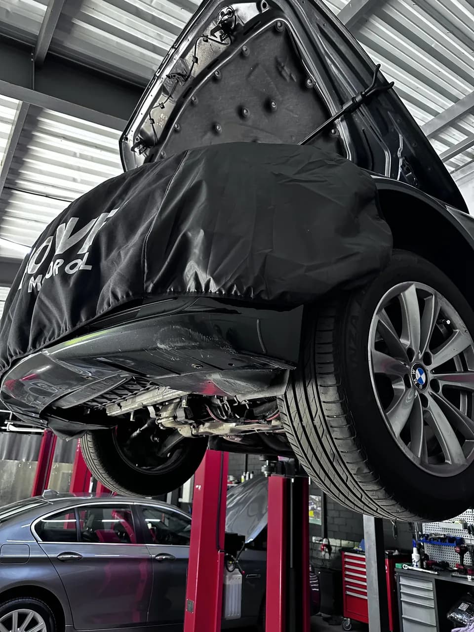 BMW 5-series or — on the lift at eMechaniq car service, Kyiv