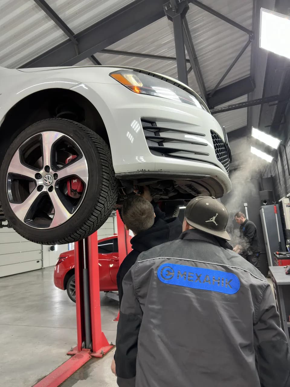 Volkswagen Golf GTI — mechanic at work at eMechaniq car service, Kyiv