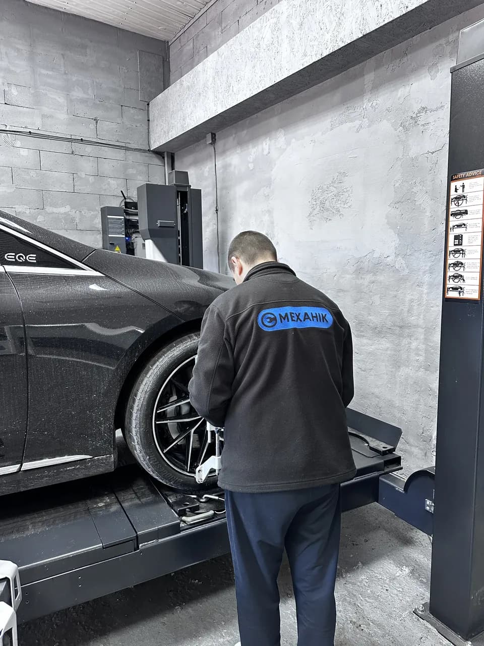 Mercedes EQE W294 — mechanic at work at eMechaniq car service, Kyiv