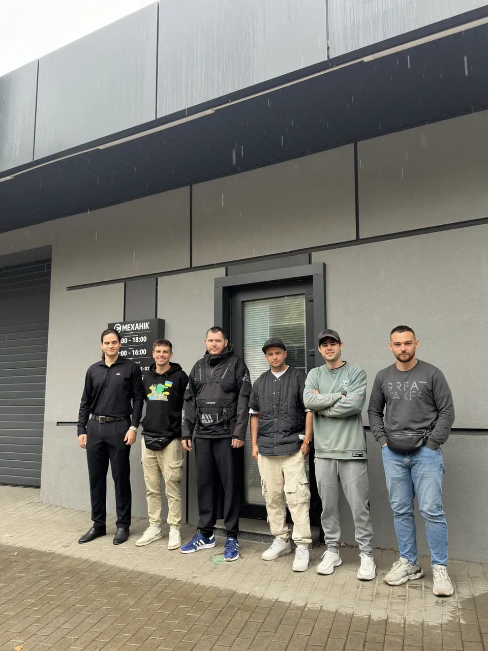 The eMechaniq car service team by the entrance, Kyiv
